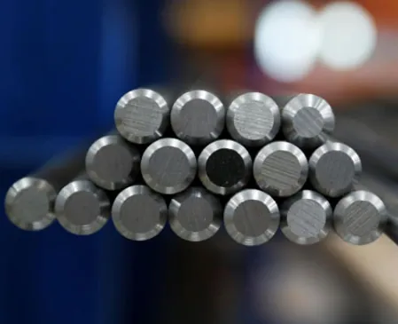 Workers discussing steel materials inside an industrial manufacturing facility